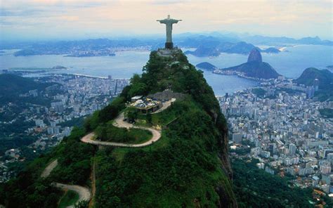the statue of christ the redeemer looks over this city|The Icon: Rio’s “Cristo” .